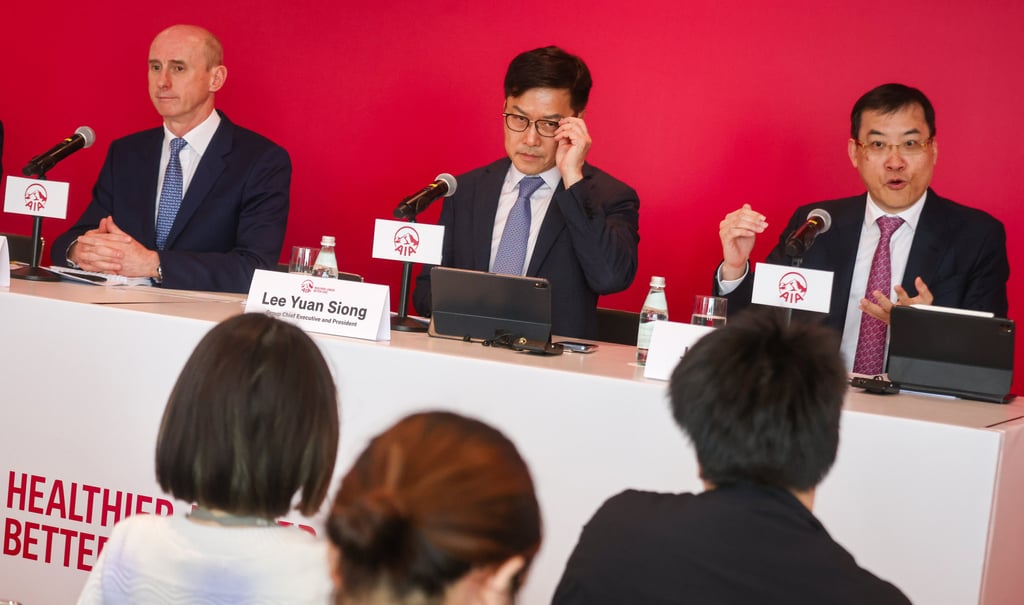 From left: AIA’s Gareth Jones, group chief financial officer; Lee Yuan Siong, group CEO and president; and Jacky Chan, regional CEO and group chief distribution officer, conduct a press briefing at AIA Central on March 14, 2024. Photo: Jonathan Wong From left: AIA’s Gareth Jones, group chief financial officer; Lee Yuan Siong, group CEO and president; and Jacky Chan, regional CEO and group chief distribution officer, conduct a press briefing at AIA Central on March 14, 2024. Photo: Jonathan Wong