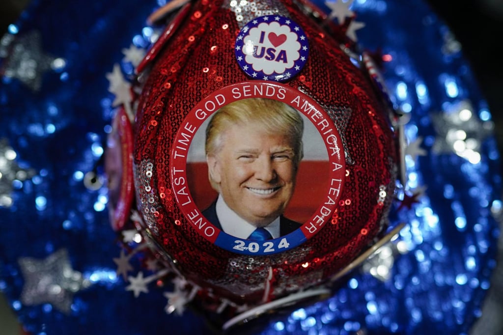 Supporters of former US president and 2024 presidential hopeful Donald Trump wait for him to speak at a “Get Out the Vote” rally in Rome, Georgia, on March 9, wearing pro-Trump pins. Photo: AFP Supporters of former US president and 2024 presidential hopeful Donald Trump wait for him to speak at a “Get Out the Vote” rally in Rome, Georgia, on March 9, wearing pro-Trump pins. Photo: AFP
