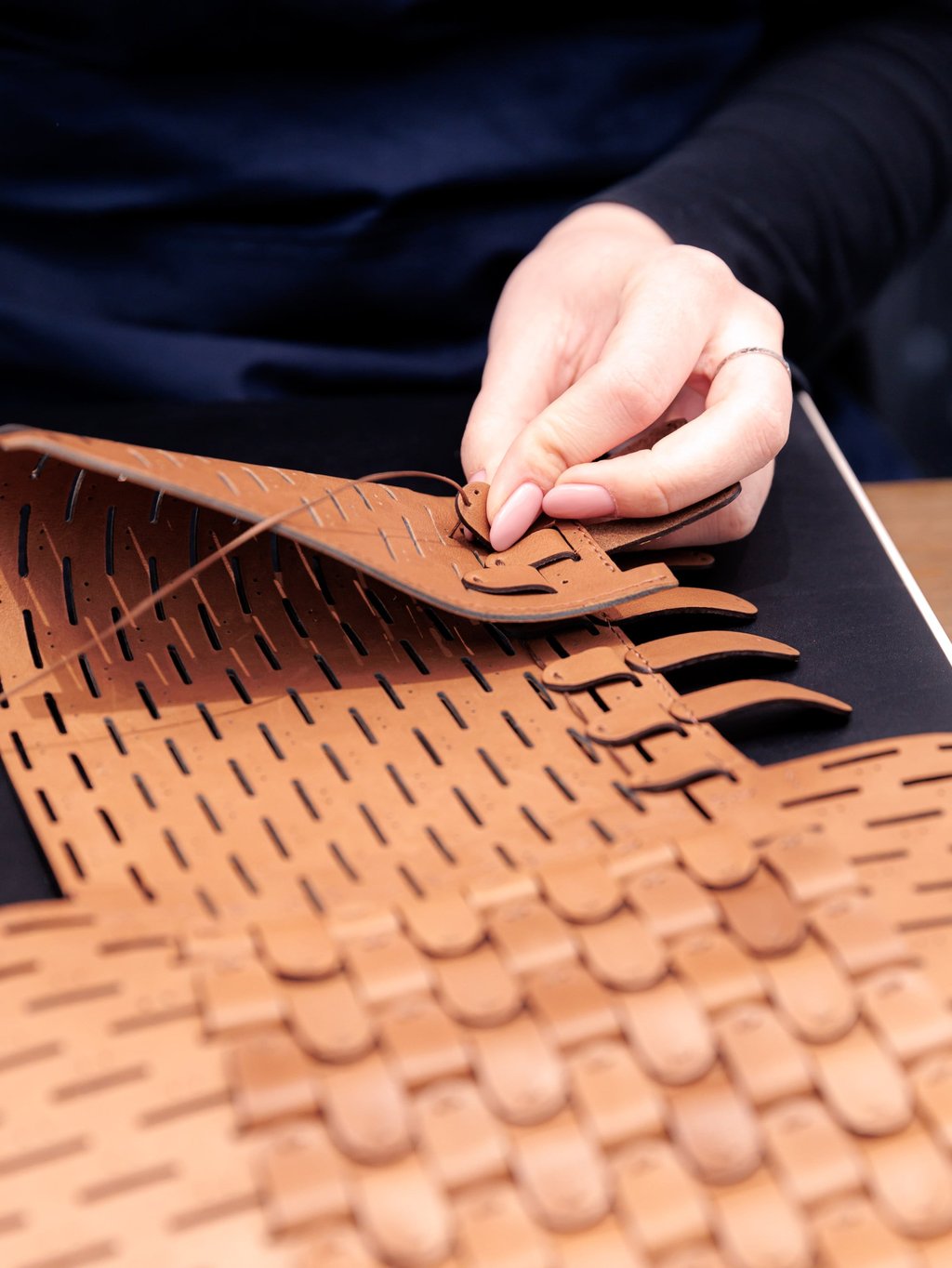 Hand stitching, a key part of the Delvaux approach
