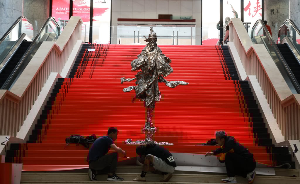 Workers add the finishing touches to a display at the Heritage Museum. The statues will be on display from March 15 to July 2. Photo: May Tse