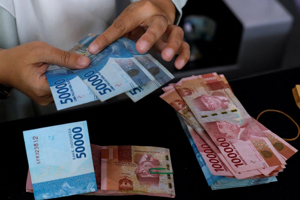 Indonesian rupiah banknotes at a money changer in Jakarta. Some voters in Indonesia now see elections as a “season of money”. Photo: Reuters