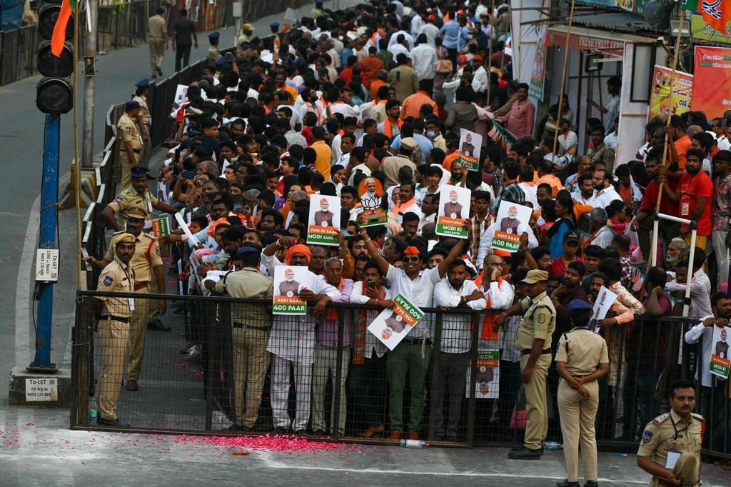 Supporters await the arrival of India’s Prime Minister Narendra Modi at a road show as part of Bharatiya Janata Party’s election campaign in Hyderabad. Photo: AFP Supporters await the arrival of India’s Prime Minister Narendra Modi at a road show as part of Bharatiya Janata Party’s election campaign in Hyderabad. Photo: AFP