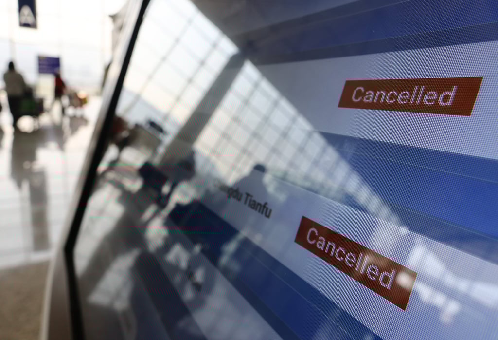 Flight information is displayed on a monitor at the Hong Kong international airport on January 11. A wave of flight cancellations by Cathay Pacific early this year has negatively affected customer confidence and its brand reputation. Photo: Dickson Lee