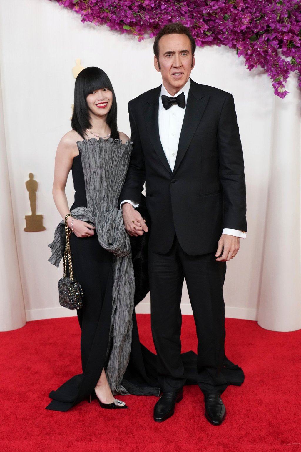 Riko Shibata and Nicolas Cage are still going strong, and looked glamorous on the red carpet at the recent Oscars ceremony on March 10. Photo: Invision/AP