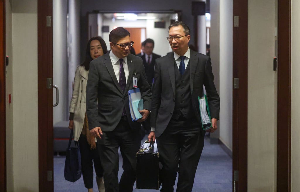 Secretary for Security Chris Tang (left) and Secretary for Justice Paul Lam leave after an Article 23 meeting. The government had requested to push forward a second reading on the bill. Photo: Edmond So Secretary for Security Chris Tang (left) and Secretary for Justice Paul Lam leave after an Article 23 meeting. The government had requested to push forward a second reading on the bill. Photo: Edmond So