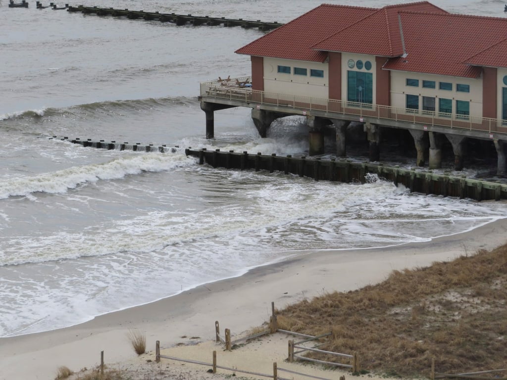 Only a narrow strip of sand sits between the ocean waves and the dunes in front of the Ocean Casino Resort. Photo: AP