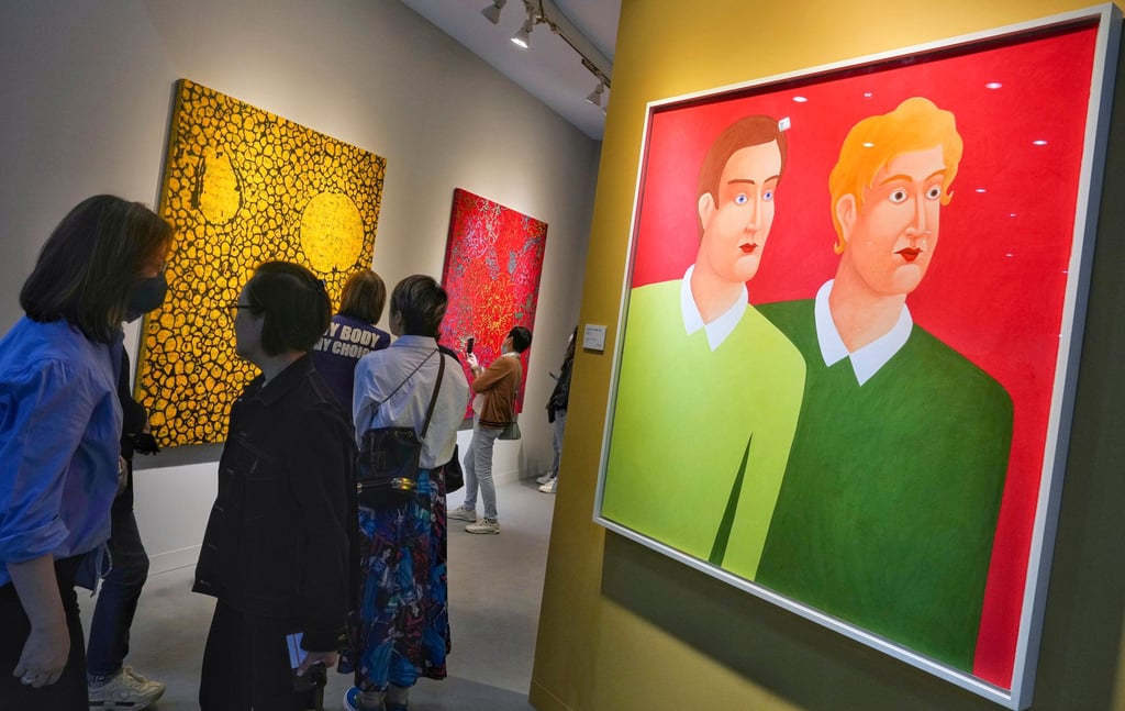People looking at art during Art Basel in Hong Kong in 2023. Studies show that viewing art can lower stress levels and alleviate anxiety. Photo: Elson Li