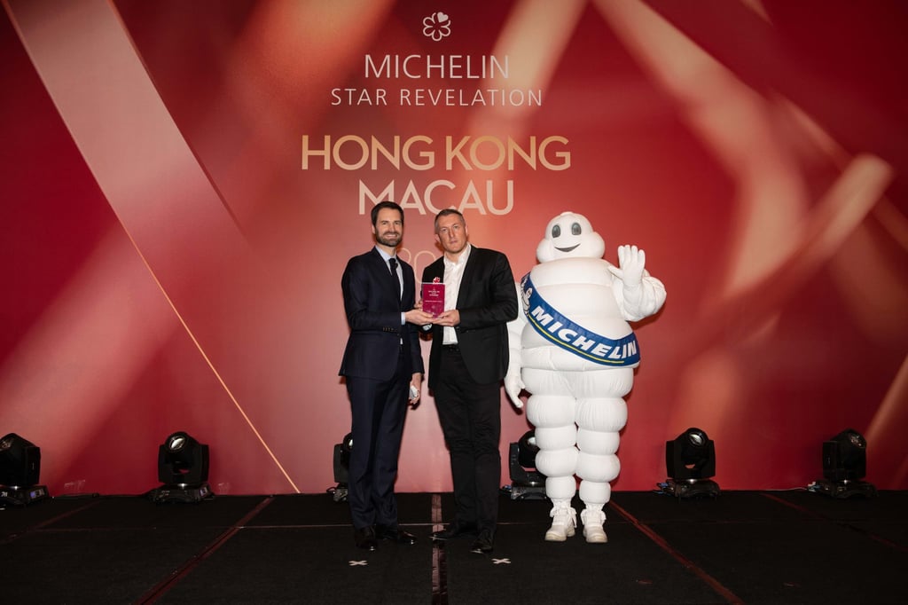 Poullennec on stage at the Michelin Guide Hong Kong and Macau unveiling ceremony, with chef Olivier Elzer of Hong Kong restaurant L’Envol, in 2019.