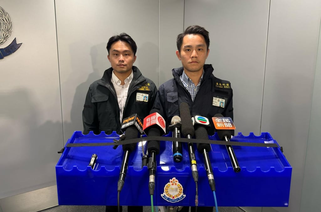 (From left) Senior Inspector Ng Kam-chung and Chief inspector Lo Ka-chun announce the latest arrests in connection with a multimillion dollar raid on a Causeway Bay watch store. Photo: Handout