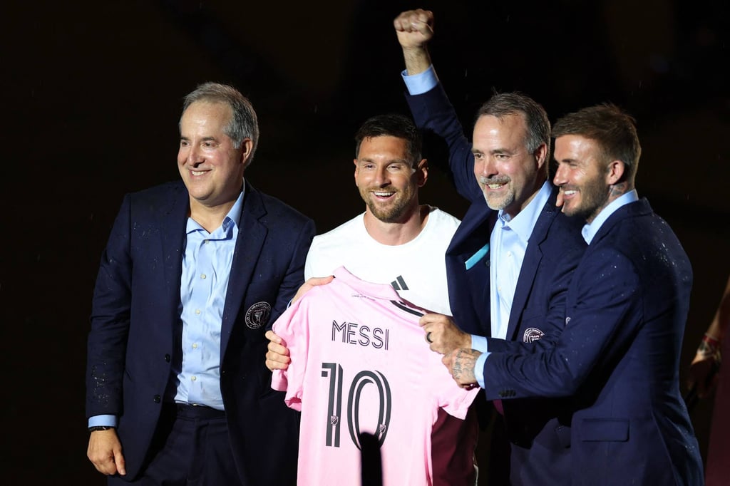 David Beckham (right) continues to work in football after his retirement and is now president of Inter Miami CF club. He’s pictured here with star player Lionel Messi (second from left). Photo: AFP
