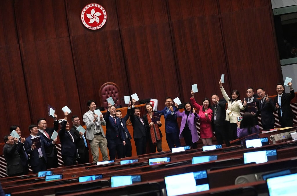 Lawmakers take pictures after the voting of the Article 23 bill in Hong Kong’s Legislative Council. Photo: Elson Li Lawmakers take pictures after the voting of the Article 23 bill in Hong Kong’s Legislative Council. Photo: Elson Li