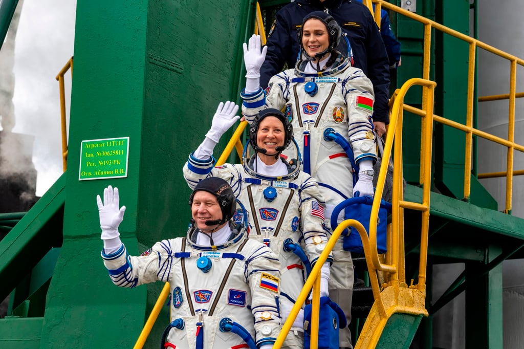 Nasa astronaut Tracy Dyson (centre), Russian cosmonaut Oleg Novitsky (bottom) and Marina Vasilevskaya of Belarus wave as they board the Soyuz spacecraft in Kazakhstan on Thursday. Photo: Roscosmos via AP