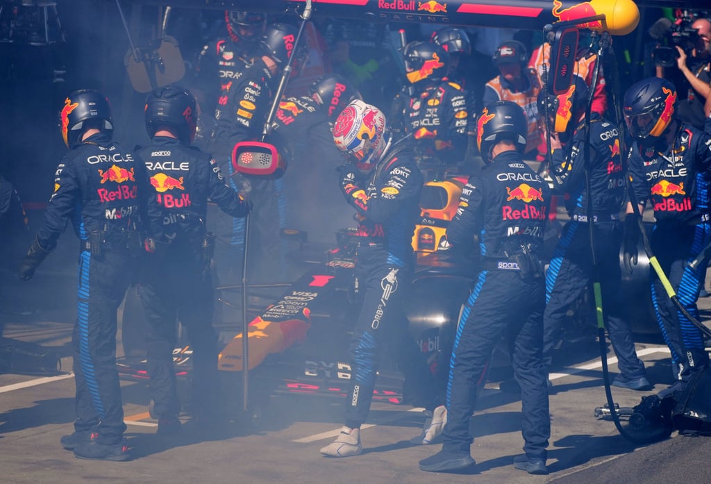 Red Bull’s Max Verstappen returns to the pits after retiring from the race. Photo: Reuters Red Bull’s Max Verstappen returns to the pits after retiring from the race. Photo: Reuters