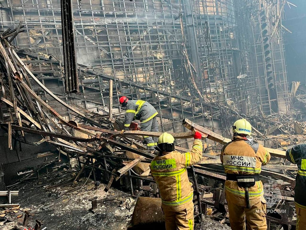 Russian rescuers work inside the Crocus City Hall on the western edge of Moscow on Saturday following an attack a day earlier. Photo: Russian Emergency Ministry Press Service via AP
