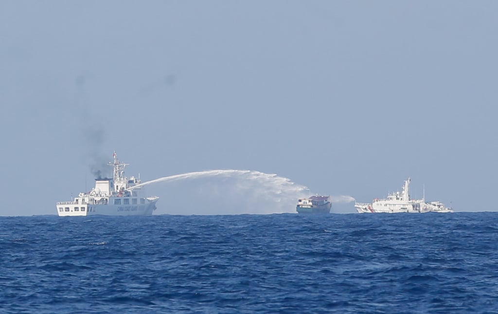 Chinese Coast Guard vessels firing water cannons at the civilian supply boat Unaizah May 4. Photo: Jeoffrey Maitem Chinese Coast Guard vessels firing water cannons at the civilian supply boat Unaizah May 4. Photo: Jeoffrey Maitem