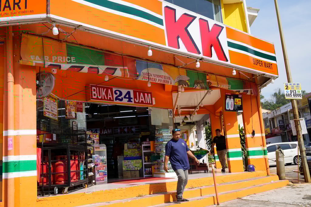 A customer walk out from KK Mart convenience store in Puchong area on the outskirts of Kuala Lumpur, Malaysia, on Tuesday. Photo: AP