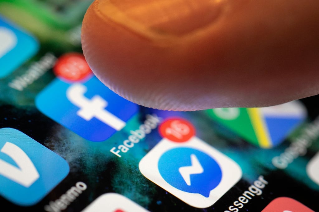 An icon for the Facebook app is seen on a phone screen. Loo’s alleged bomb threats were made via Facebook Messenger, according to court documents. Photo: AP An icon for the Facebook app is seen on a phone screen. Loo’s alleged bomb threats were made via Facebook Messenger, according to court documents. Photo: AP