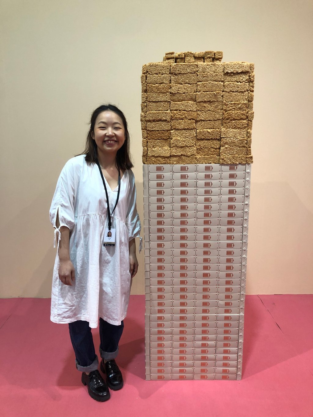 Artist Liv Tsim with her edible energy bars created with bacteria and metal. The work, called Energy Bar, was commissioned for Art Central 2024. Photo: Enid Tsui