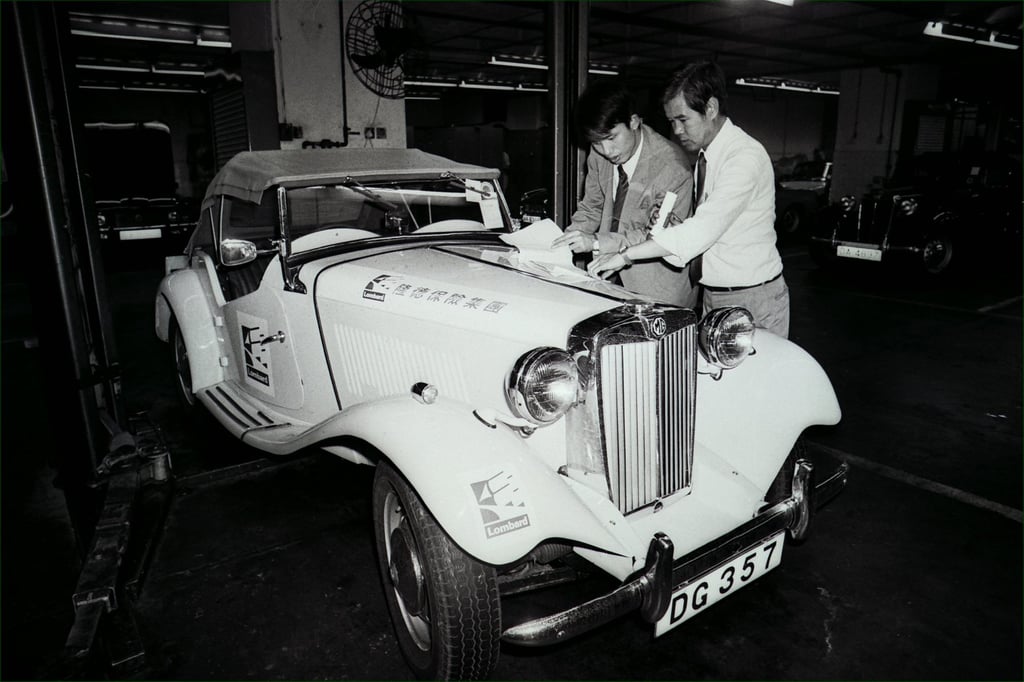 Officials from Guangzhou check the vintage vehicles, owned by members of the Classic Car Club of Hong Kong, before a rally from Hong Kong to Guangzhou, in 1986. Photo: SCMP Officials from Guangzhou check the vintage vehicles, owned by members of the Classic Car Club of Hong Kong, before a rally from Hong Kong to Guangzhou, in 1986. Photo: SCMP