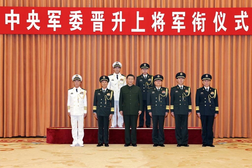 Xi Jinping (front row, centre) poses for a photo with top military brass and two newly promoted generals, Wang Renhua (back row, left) and Xiao Tianliang (back row, right), in Beijing on Thursday. Photo: Xinhua Xi Jinping (front row, centre) poses for a photo with top military brass and two newly promoted generals, Wang Renhua (back row, left) and Xiao Tianliang (back row, right), in Beijing on Thursday. Photo: Xinhua