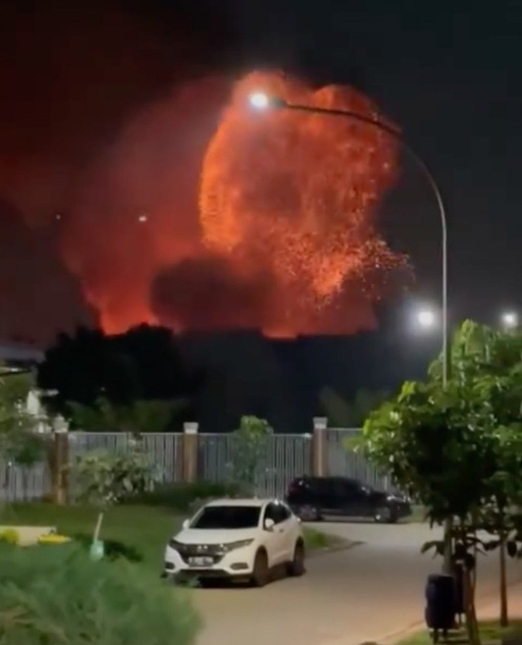 Footage on social media showed bright orange flames lighting up billowing clouds of smoke after a massive fire broke out at a military ammunition facility on the outskirts of Jakarta. Photo: Handout