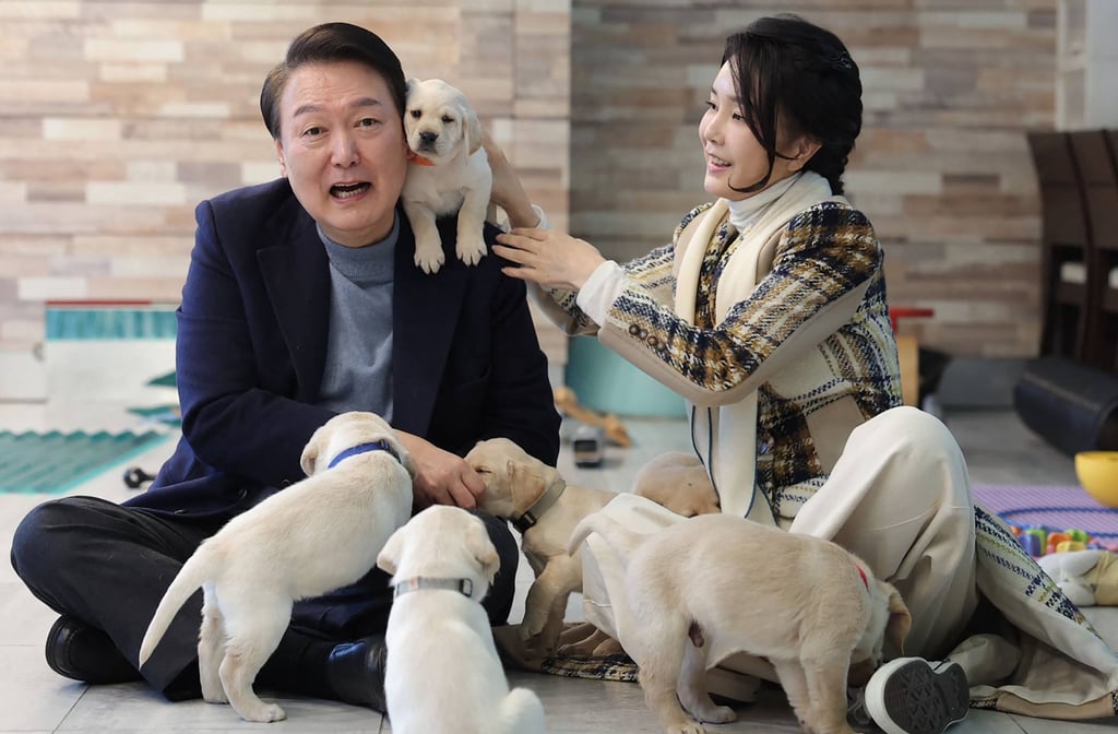 Yoon and first lady Kim pose with puppies at a guide dog school in December 2022. Kim has been an advocate for animal rights. Photo: South Korean Presidential Office / Handout via AFP Yoon and first lady Kim pose with puppies at a guide dog school in December 2022. Kim has been an advocate for animal rights. Photo: South Korean Presidential Office / Handout via AFP