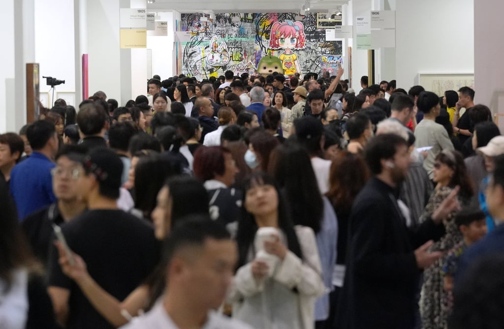 Members of the public admire artworks at Art Basel Hong Kong, where the serious business was done away from the public eye. Despite some big-ticket sales, buyers appear to have shown more caution this year. Photo: Eugene Lee
