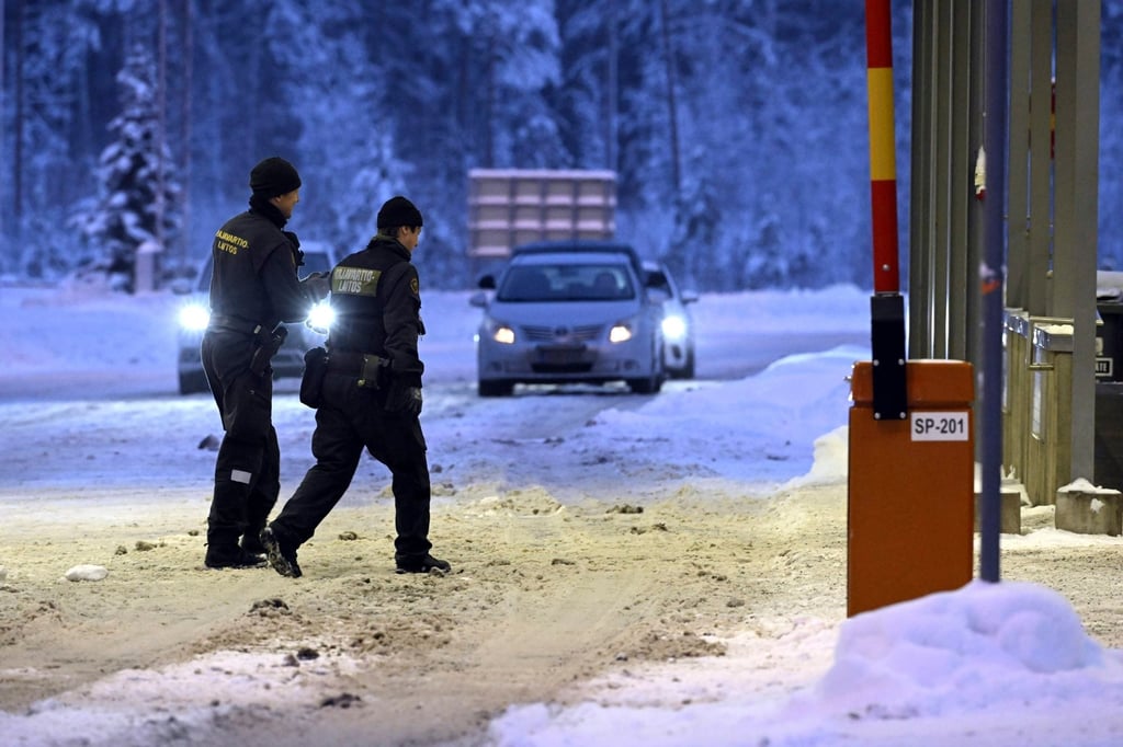 Finnish border guards walk at Vaalimaa border check point between Finland and Russia. The two neighbours share a 1,340km (830-mile) border. Photo: AP