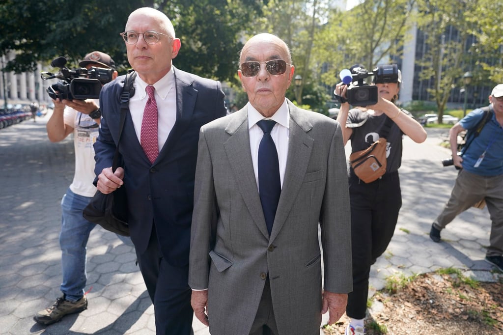 British billionaire Joe Lewis (centre) leaves Manhattan federal court in New York in July 2023. Photo: AP British billionaire Joe Lewis (centre) leaves Manhattan federal court in New York in July 2023. Photo: AP