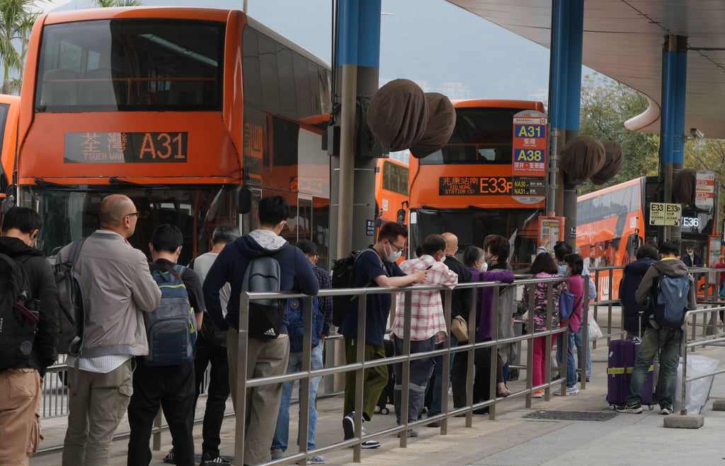 People stand in a bus queue at Hong Kong International Airport in 2023. The city’s bus companies applied for fare increases last year. Photo: Sam Tsang