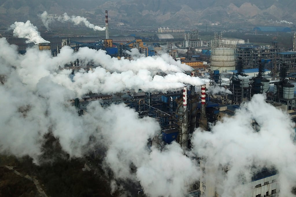 Smoke and steam rise from a coal processing plant in Hejin in central China’s Shanxi Province. Photo: AP