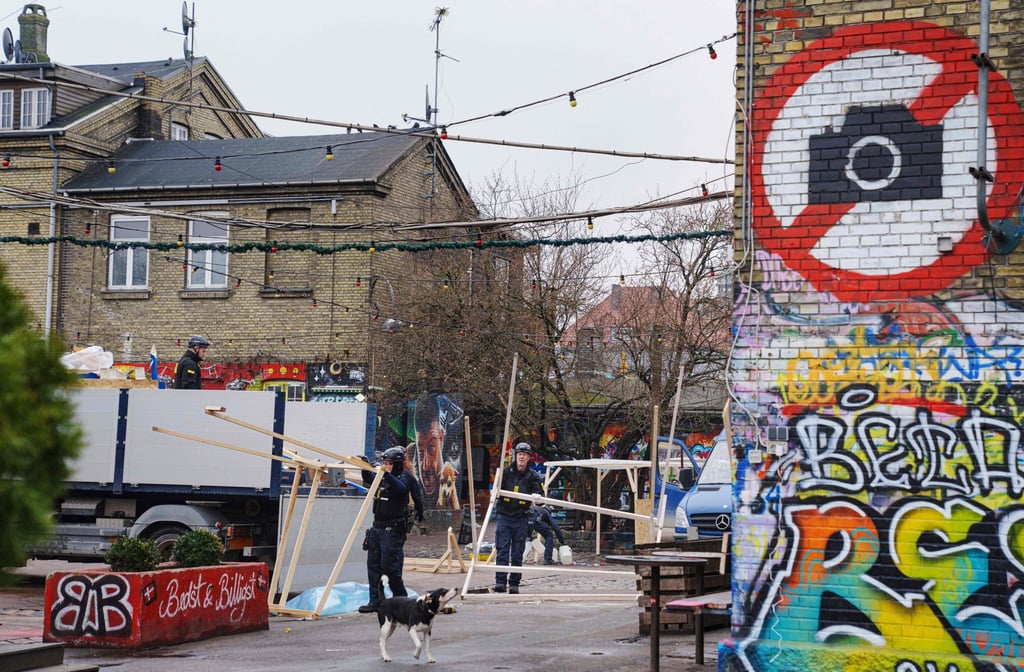 Police officers work on the closure of Pusher Street in Christiania. Photo: AFP Police officers work on the closure of Pusher Street in Christiania. Photo: AFP