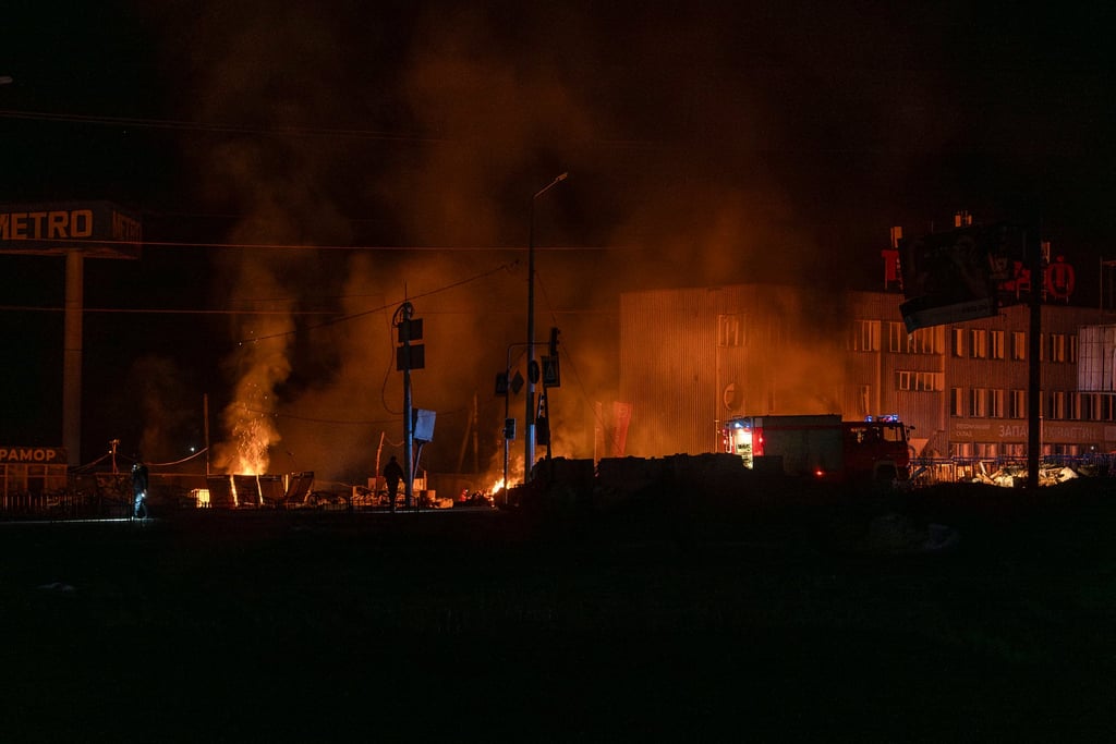 Rescuers extinguish the fire at the site of a Russian drone attack in Kharkiv, Ukraine, early on Saturday. Photo: AP Rescuers extinguish the fire at the site of a Russian drone attack in Kharkiv, Ukraine, early on Saturday. Photo: AP