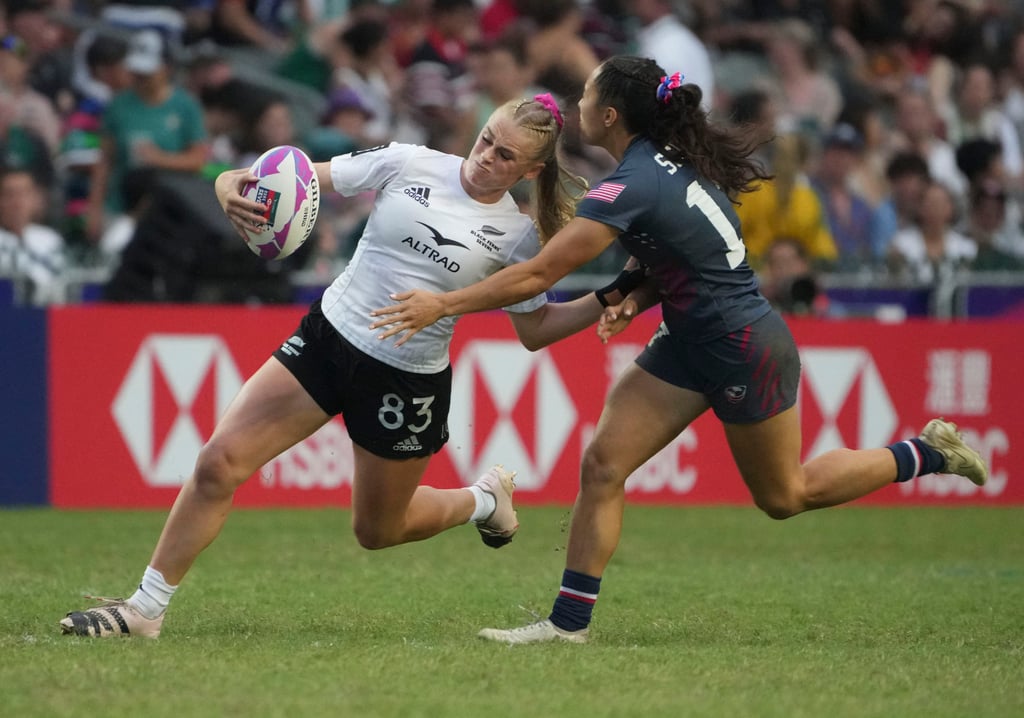 New Zealand Jorja Miller holds off Theresa Setefano on her way to scoring the opening try of the women’s final. Photo: Sam Tsang New Zealand Jorja Miller holds off Theresa Setefano on her way to scoring the opening try of the women’s final. Photo: Sam Tsang