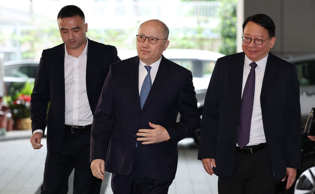 Zheng Yanxiong, the director of the central government’s liaison office in Hong Kong (centre) and Eric Chan Kwok-ki, chief secretary for administration (right) head into a closed doors two sessions briefing at the city government’s headquarters on Tuesday. Photo: Edmond So Zheng Yanxiong, the director of the central government’s liaison office in Hong Kong (centre) and Eric Chan Kwok-ki, chief secretary for administration (right) head into a closed doors two sessions briefing at the city government’s headquarters on Tuesday. Photo: Edmond So