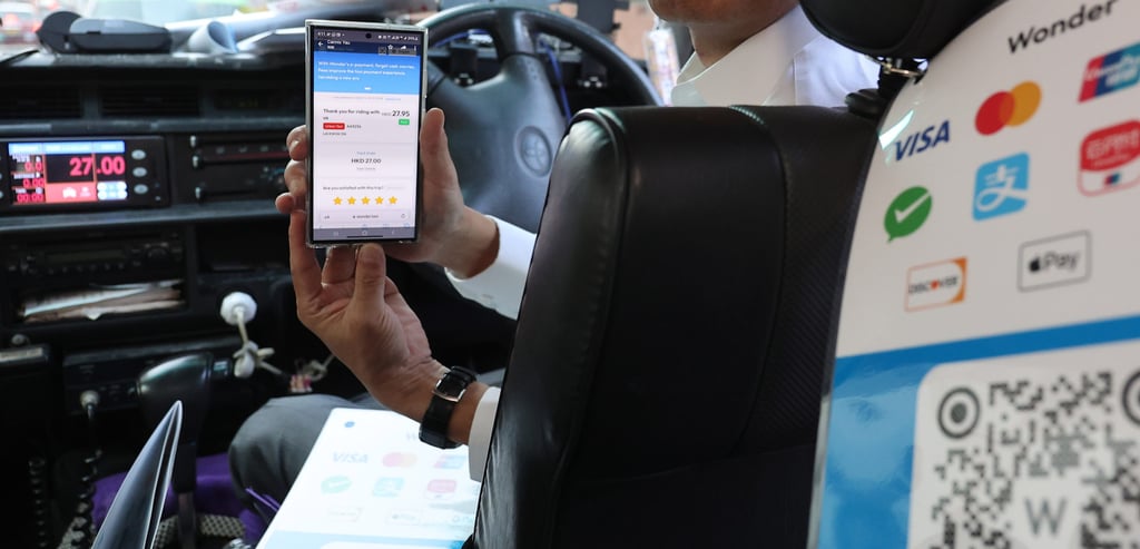 Chau Kwok-keung, chairman of The Hong Kong Taxi & Public Light Bus Association, demonstrates Wonder’s payment system in Sham Shui Po on November 2, 2023. Photo: Edmond So Chau Kwok-keung, chairman of The Hong Kong Taxi & Public Light Bus Association, demonstrates Wonder’s payment system in Sham Shui Po on November 2, 2023. Photo: Edmond So