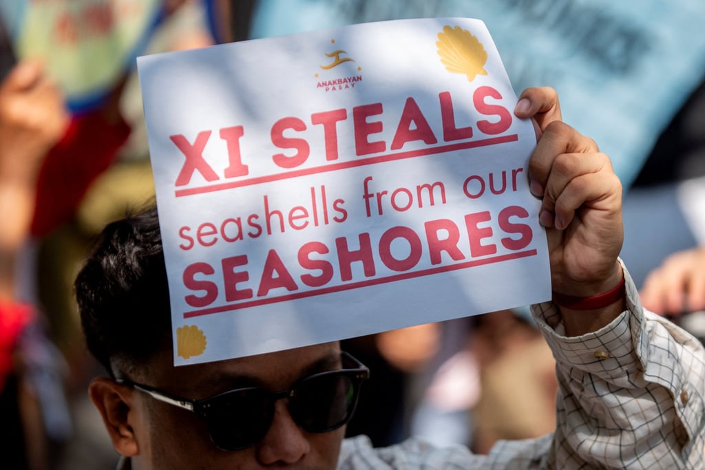 A Filipino activist holds a placard during a protest condemning China’s actions in the disputed waters of the South China Sea, outside the Chinese consulate in Makati City, Metro Manila, Philippines, on Tuesday. Photo: Reuters