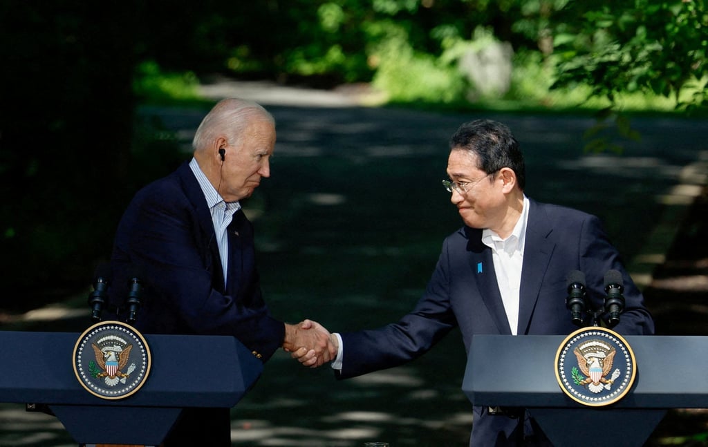 US President Joe Biden and Japanese Prime Minister Fumio Kishida shake hands during a summit at Camp David in Maryland last August. Photo: Reuters US President Joe Biden and Japanese Prime Minister Fumio Kishida shake hands during a summit at Camp David in Maryland last August. Photo: Reuters