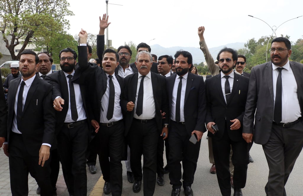 Lawyer and supporters of former PM Imran Khan’s party outside the Islamabad Supreme Court. Khan has faced a series of legal challenges that he accused the military establishment of orchestrating. Photo: EPA-EFE