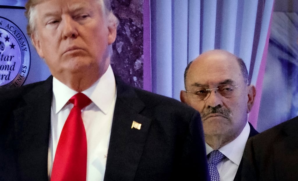 Allen Weisselberg, right, stands behind then President-elect Donald Trump in the lobby of Trump Tower in New York, on January 11, 2017. Weisselberg was sentenced to five months in jail after pleading guilty last month to two counts of perjury. Photo: AP