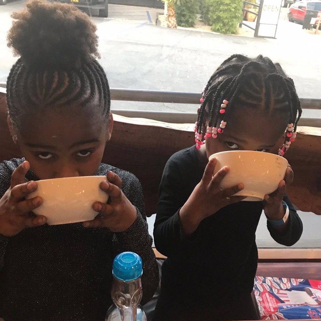 Jackson (left) with little sister August. Photo: @charlizeafrica/Instagram