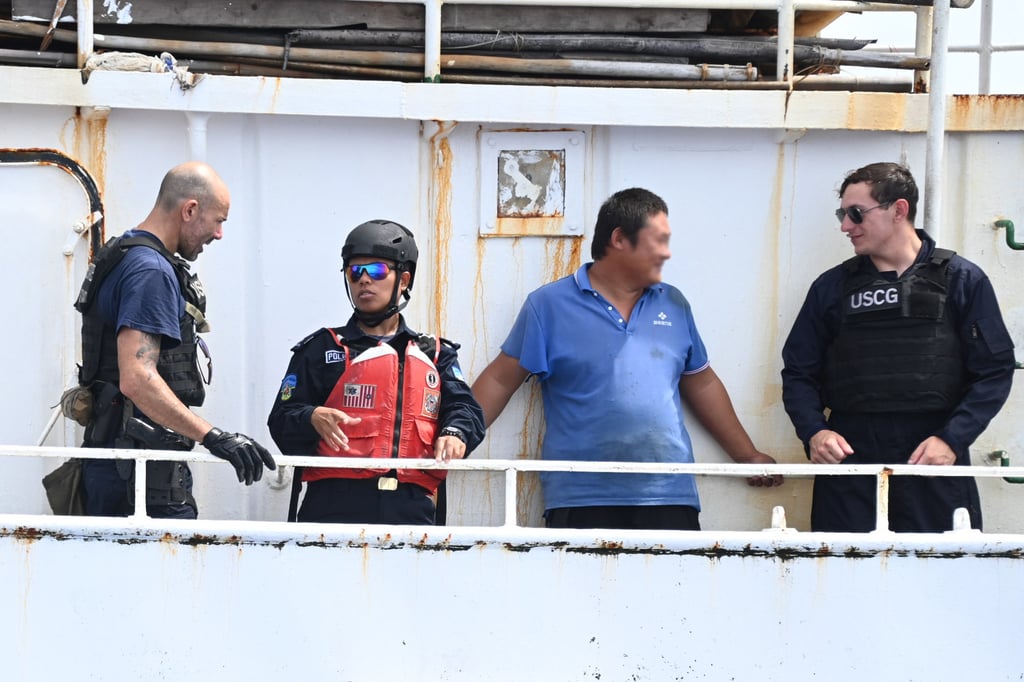 A boarding team from US Coast Guard cutter Harriet Lane accompanied by a Vanuatu police officer talk to a member of crew on a fishing vessel in the South Pacific Ocean in February. Photo: US Coast Guard Pacific Area A boarding team from US Coast Guard cutter Harriet Lane accompanied by a Vanuatu police officer talk to a member of crew on a fishing vessel in the South Pacific Ocean in February. Photo: US Coast Guard Pacific Area