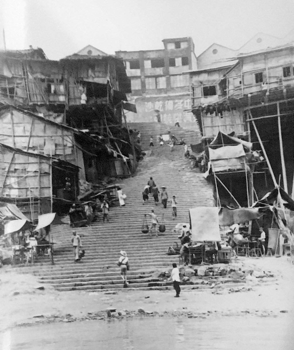 To reach Chungking’s city centre, residents and visitors climbed stone staircases hewn from the cliffside. Photo: A Danger Shared/Melville Jacoby To reach Chungking’s city centre, residents and visitors climbed stone staircases hewn from the cliffside. Photo: A Danger Shared/Melville Jacoby