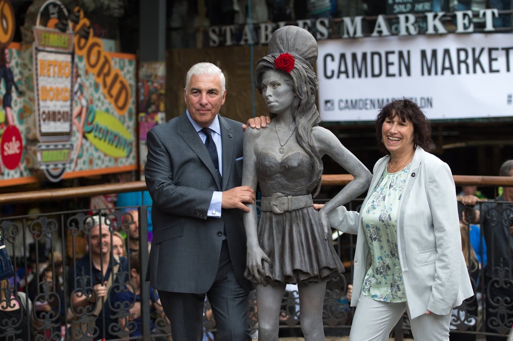 Mitch Winehouse and Janis Winehouse pose for a picture with a statue of their late daughter, Amy Winehouse, after it was unveiled in Camden’s Stables Market, in London, England, in 2014. Photo: AP Photo Mitch Winehouse and Janis Winehouse pose for a picture with a statue of their late daughter, Amy Winehouse, after it was unveiled in Camden’s Stables Market, in London, England, in 2014. Photo: AP Photo