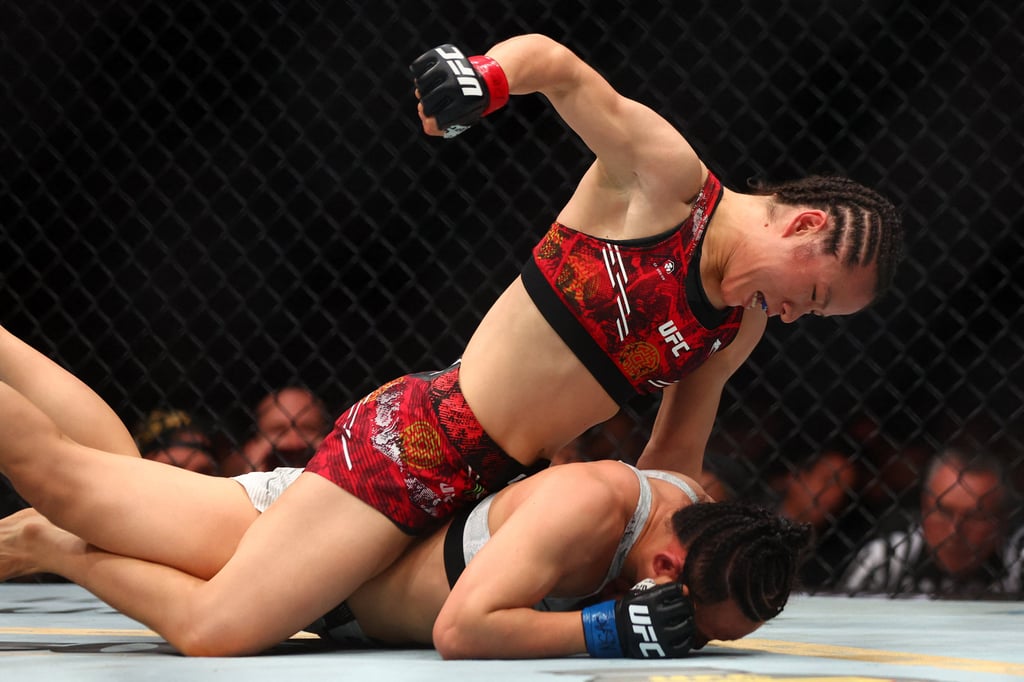 Zhang Weili takes aim at a prone Yan Xiaonan at T-Mobile Arena. Photo: USA TODAY Sports via Reuters Con Zhang Weili takes aim at a prone Yan Xiaonan at T-Mobile Arena. Photo: USA TODAY Sports via Reuters Con