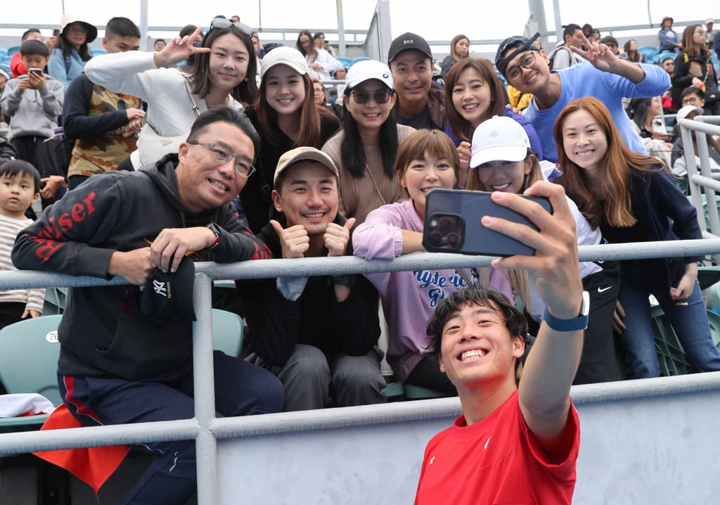 Wong takes a selfie with family and friends after a Davis Cup win. Photo: Yik Yeung-man Wong takes a selfie with family and friends after a Davis Cup win. Photo: Yik Yeung-man