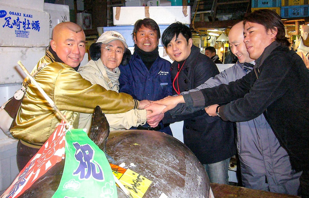 Ricky Cheng (third right) celebrates after buying a tuna in a joint bid at a Tokyo auction in 2011. Photo: Handout Ricky Cheng (third right) celebrates after buying a tuna in a joint bid at a Tokyo auction in 2011. Photo: Handout