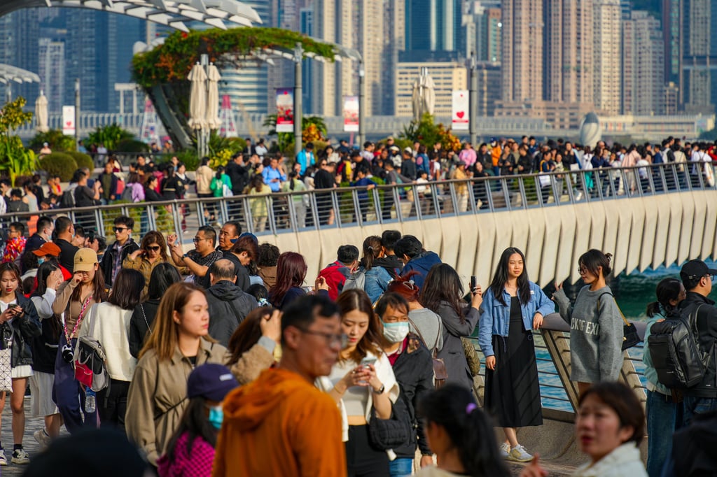 Visitors pack the Tsim Sha Tsui waterfront during the Lunar New Year holiday. Photo: Eugene Lee Visitors pack the Tsim Sha Tsui waterfront during the Lunar New Year holiday. Photo: Eugene Lee