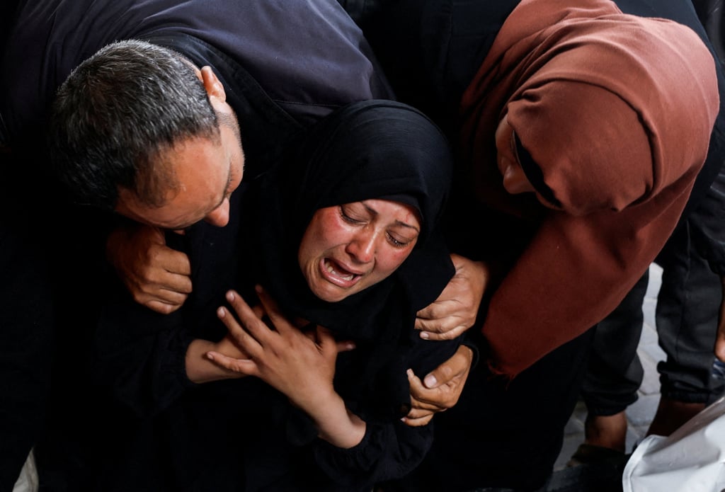 A woman reacts next to the bodies of Palestinians killed in Israeli strikes in Rafah on Tuesday. Photo: Reuters A woman reacts next to the bodies of Palestinians killed in Israeli strikes in Rafah on Tuesday. Photo: Reuters