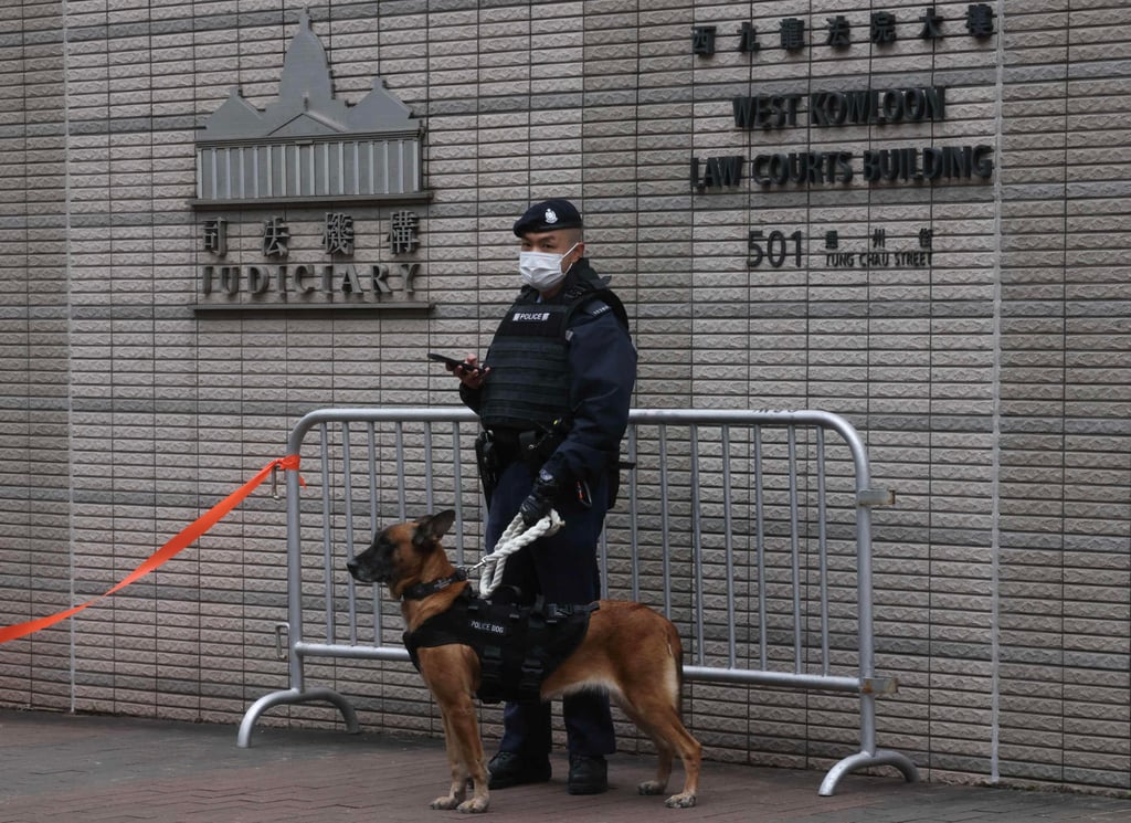 A police officer outside West Kowloon Court, where media tycoon Jimmy Lai is on trial. Photo: Jonathan Wong A police officer outside West Kowloon Court, where media tycoon Jimmy Lai is on trial. Photo: Jonathan Wong